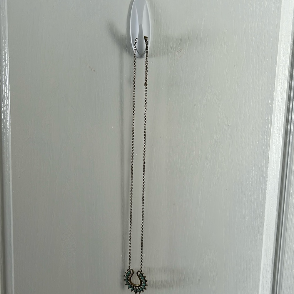 Gold Premiere necklace with turquoise accents.